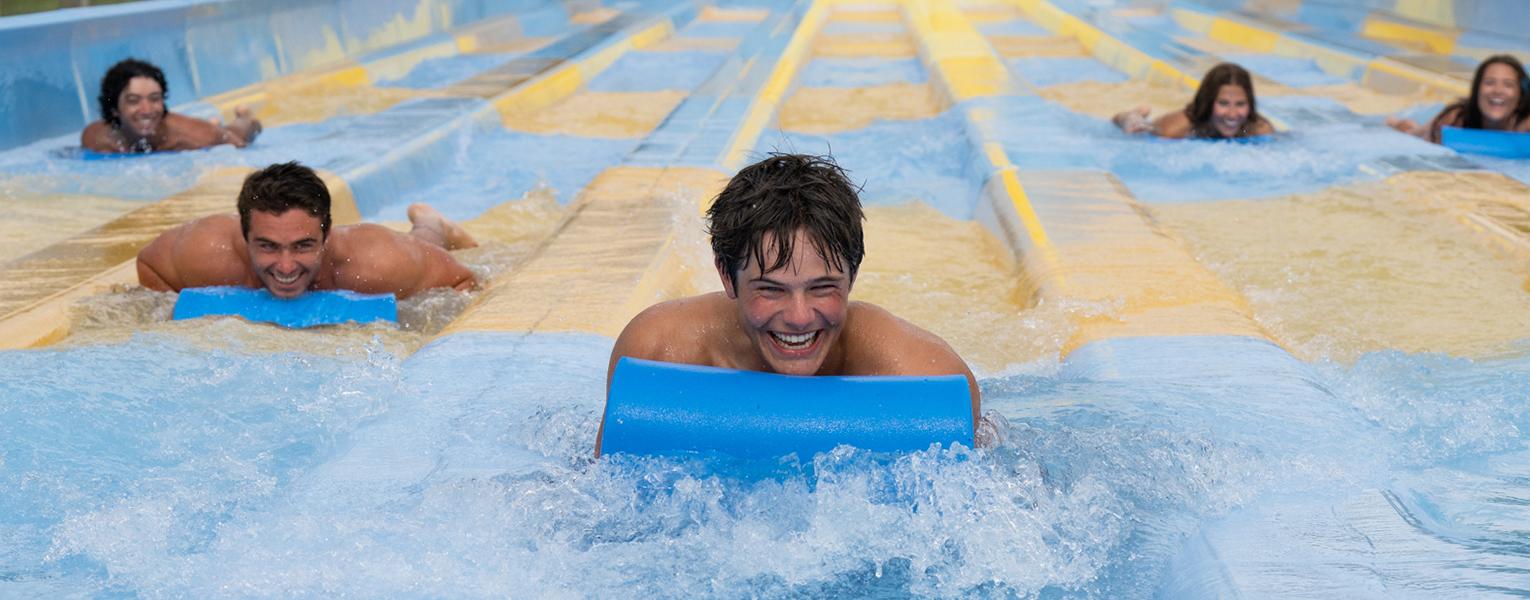 teenagers on water slide