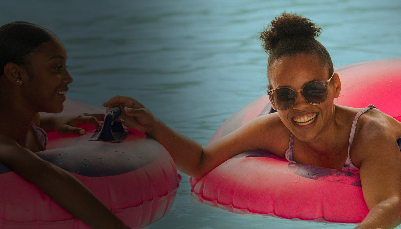girls floating in Action River