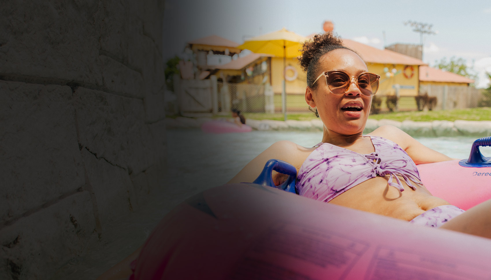 Women wearing sunglasses and lounging in pink innertube in water