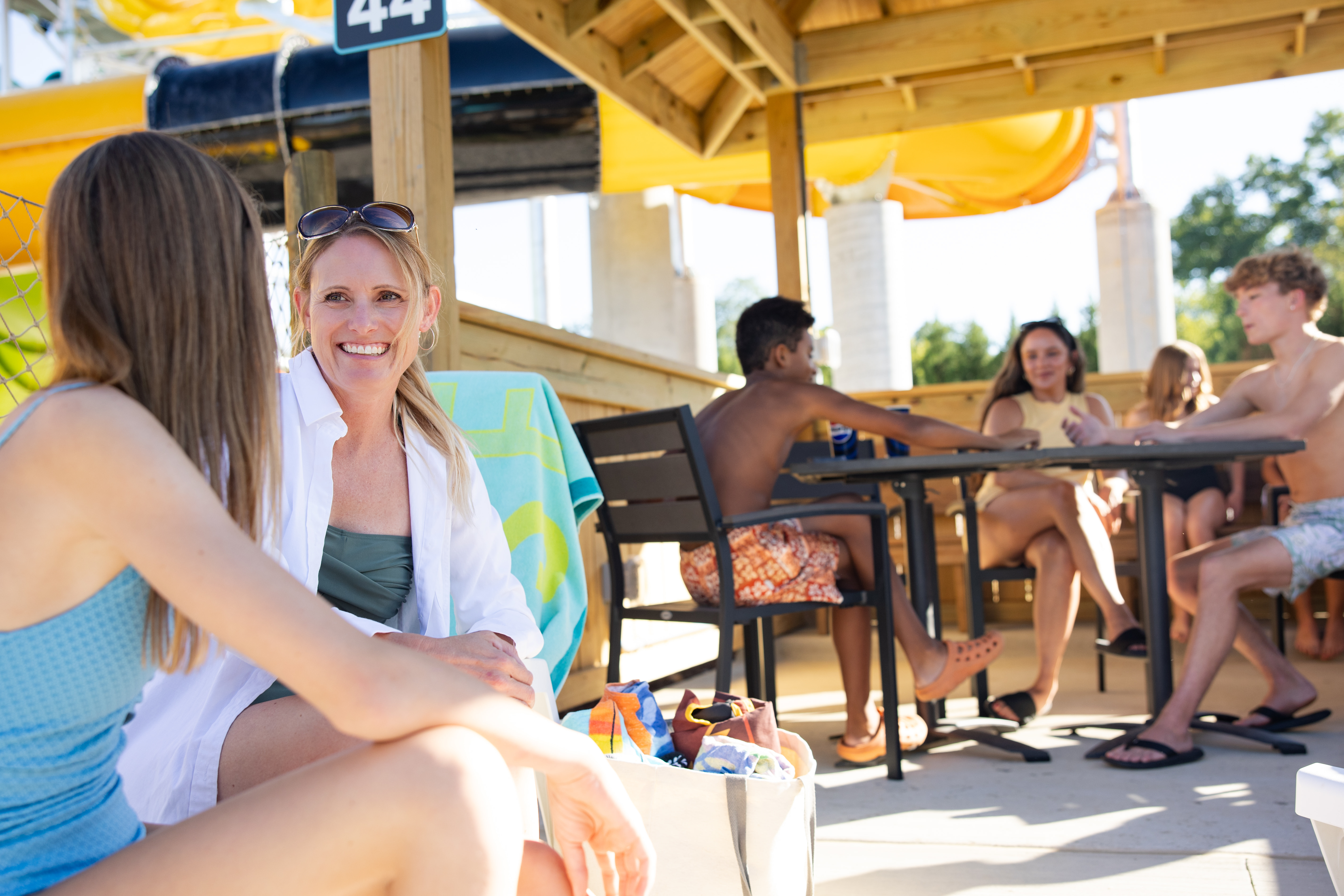 family in cabana at water park