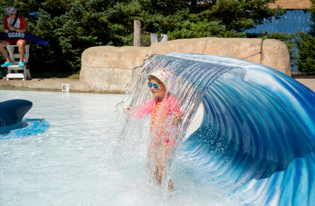 child in waterfall attraction
