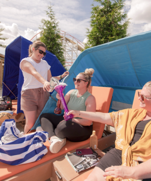 women laughing on chaise loungers
