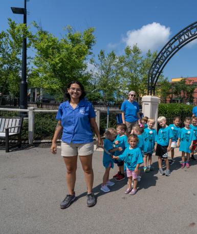 ZooKids instructor leading group around the zoo
