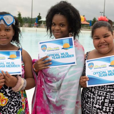 kids holding certificates