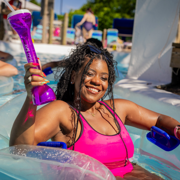 guest with purple cup in hand